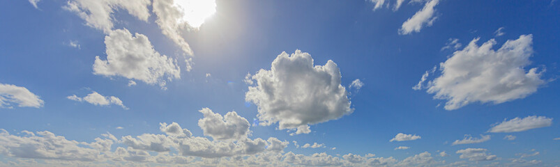 Wall Mural - Image of a partly cloudy and partly clear sky during the day