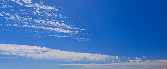 Wall Mural - Image of a partly cloudy and partly clear sky during the day