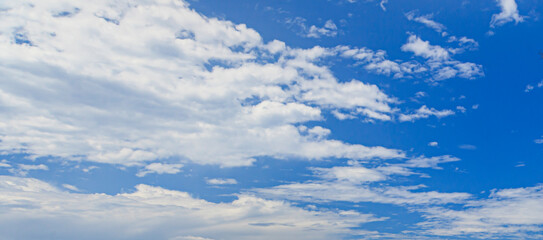 Wall Mural - Image of a partly cloudy and partly clear sky during the day