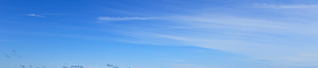 Wall Mural - Image of a partly cloudy and partly clear sky during the day