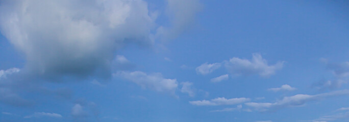 Wall Mural - Image of a partly cloudy and partly clear sky during the day