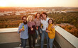 © kegfire - Happy friends during party on rooftop
