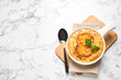 © New Africa - Tasty homemade french onion soup served on white marble table, flat lay. Space for text