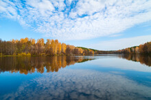 Beautiful Autumn Landscape With Clear Blue Lake And Yellow Autumn Trees.