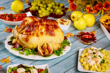 Table with traditional food for Thanksgiving holiday.