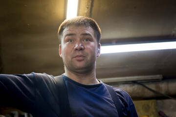 Wall Mural - Close-up portrait of a man in the workplace