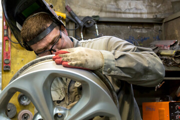 Wall Mural - Welding a wheel rim from an aluminum car