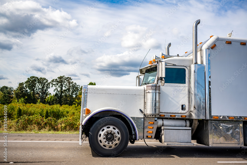 Powerful big rig classic semi truck tractor with vertical pipes and ...