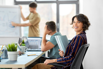 Canvas Print - business, work and people concept - smiling businesswoman with folder at office conference