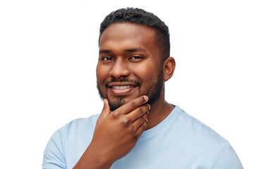 Wall Mural - people, grooming and shaving concept - portrait of happy smiling young african american man touching his beard over white background