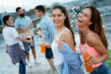 Wall Mural - Having a great time with friends, having fun at rooftop party