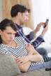 © auremar - upset woman because man is using his phone