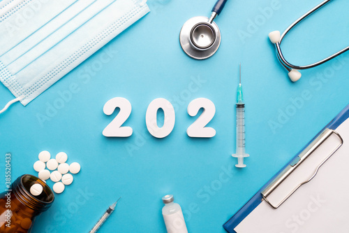 2021 Happy New Year Banner For Health Care And Medical Concept 2021 Number With Syringe Stethoscope Sugical Face Mask Doctor Order Chart Pills Bottle And Medicine Vial On Blue Background Buy