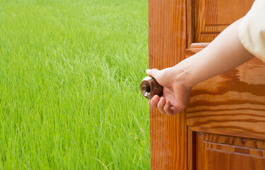 Wall Mural - Women hand open door knob or opening the door, grand opening, Close up hand open door.