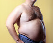 © sanek70974 - fat man on yellow background
