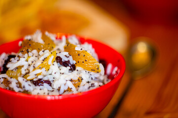 Wall Mural - handmade preparation of treats for traditional Orthodox Christmas - rice pudding with fruits, cranberries, honey, nuts, Church candles