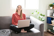 © AntonioDiaz - Cute woman using a computer at home
