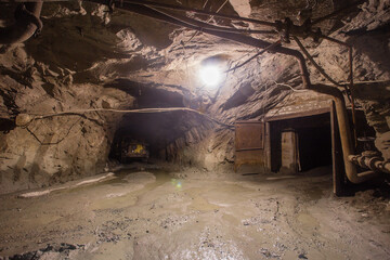 Underground gold ore mine tunnel two ways