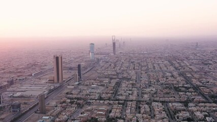 Wall Mural - Skyline of Riyadh, SAUDI ARABIA along King Fahd Road highway in the morning / 4K