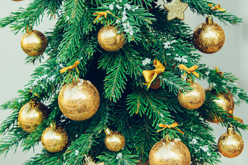 Wall Mural - Green fir tree with golden balls. Christmas wallpaper.
