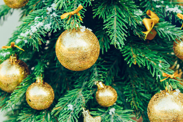Wall Mural - Green fir tree with golden balls. Christmas wallpaper.