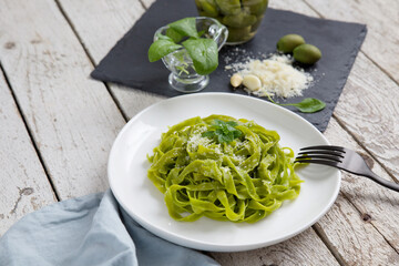 Tagliatelle pasta with spinach and parmesan. Background image