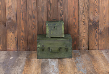 Sticker - green military boxes on a wooden background