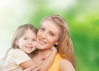 Canvas Print - Happy beautiful mother and daughter hugging