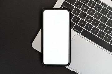 Modern smartphone mockup on Laptop with black background