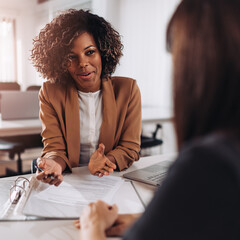 Wall Mural - Woman consulting with a female agent