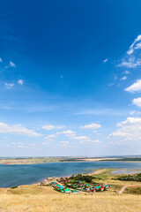 Sticker - The Aslykul lake is a resort in Davlekanovo district, Bashkortostan, Russia. Panorama with village next to water