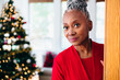 © Gerald Carter/Creative Flame - Portrait of Senior Black woman looking at camera on Christmas and smiling