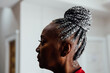 © Gerald Carter/Creative Flame - Profile of Senior Black woman with grey hair and braids