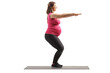 Full length profile shot of a pregnant woman exercising squats