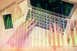 © peshkova - Double exposure of woman hands working on computer and forex graph hologram drawing. Top View. Financial analysis concept.