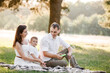 © Andriy Medvediuk - father, mother and son blow soap bubbles in the park together on a sunny summer day. happy family having fun outdoor