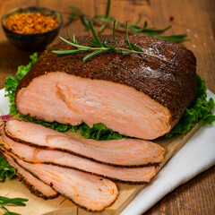 Roasted Turkey Breast Cajun Style Deli Lunch Meat on Old Wooden Background. Selective focus.