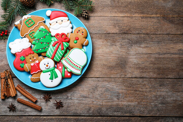 Delicious Christmas cookies on wooden table, flat lay. Space for text