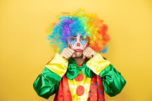 Clown Standing Over Yellow Insolated Yellow Background Depressed And Worry For Distress, Crying Angry And Afraid. Sad Expression