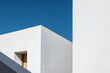 © Stephen - Generic geometric minimalist white architecture on a clear sunny day.