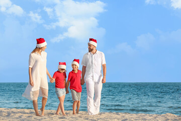 Wall Mural - Happy family celebrating Christmas at tropical resort