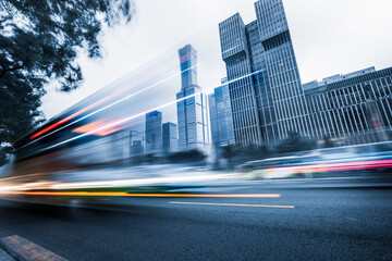 Wall Mural - traffic light trails and modern street.