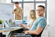 © Syda Productions - business and people concept - happy smiling man in glasses at office conference