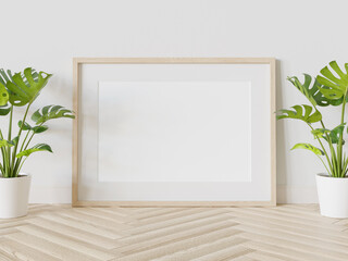 Wooden frame leaning on floor in interior mockup. Template of a picture framed on a wall 3D rendering