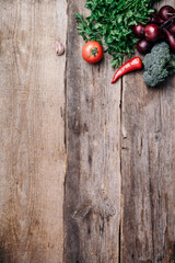 Wall Mural - Copper pot, herbs, purple onion, pumpkin, tomato, broccoli, pepper, cabbage, carrot, parsley, calafior, zucchini on wooden background. Top view. Copy space. Banner. Autumn harvest food cooking concept