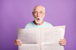 Photo of shocked funky old grey hair man open mouth hold read newspaper wear eyeglasses blue t-shirt isolated on violate background