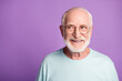 © deagreez - Portrait of beard old man wear light blue t-shirt spectacles look empty space isolated on violet color background