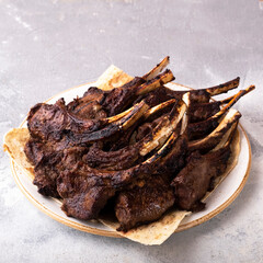 Wall Mural - Grilled lamb chops on a plate. Grilled Mutton