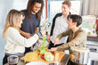 © Robert Kneschke - Laughing students prepare salad together in shared kitchen