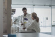 © ReeldealHD images - Two female scientists discussing results of experiment